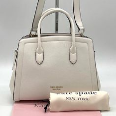 Brand New With Tag Kate Spade Knott Medium Satchel Crossbody Bag Not Outlet Style 8.25"H X 11.25"W 4.75"D Handle Drop: 3.75" Strap Drop: 22" Pebbled Leather With Smooth Italian Leather Trim Textured Pvc Lining Pinmount Logo Satchel With Open Top And Dog-Clip Closure Interior Snap-Tab Slip Pocket Interior Zipper Pocket Optional (And Adjustable) Crossbody Strap Pale Gold-Tone Hardware Fits Current Iphone, Large Continental Wallet, Ipad Imported Kate Spade Knott, Kate Spade Satchel, Birkenstock Boston Shearling, Purple Purse, Boston Shearling, Black Leather Satchel, Leather Satchel Handbags, Bags Kate Spade, Dog Clip