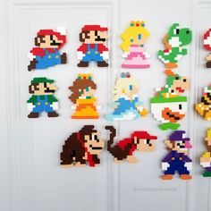 the nintendo characters are made out of legos and have been placed on a door