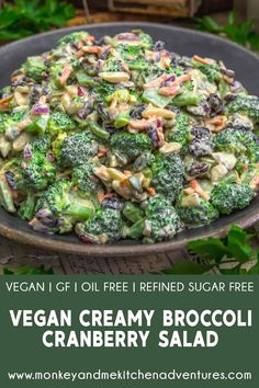 vegan creamy broccoli cranberry salad on a platter with text overlay