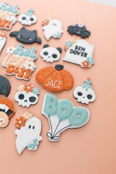 a bunch of decorated cookies sitting on top of a table