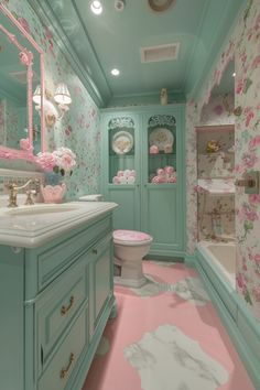 the bathroom is decorated in pastel blue and pink colors, with floral wallpaper on the walls