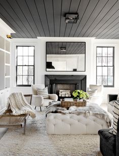 a living room filled with furniture and a fire place