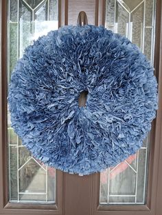 a blue wreath hanging on the front door