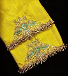 Here Are The Latest Designs For Bridal Blouses With Maggam Work. The Maggam Work With Kundan, Thread And Spring Can Be Customised Along With The Cloth Color You Want To Choose. Having These Kind Of Maggam Work Blouses Is Very Trendy For Traditional Gatherings And Poojas.  This Enhances The Beauty Of Any Saree When This Is Teamed Up With Different Kind Of Maggam Designs. The Combination Of Aari And Zardosi Works Make This Maggam Designs Look Very Elegant And Beautiful. We Customize The Blouse As Luxury Handwork Silk Thread Blouse Piece, Square Shape Aari Work Blouse Design, Unstitched Wedding Choli With Motifs, Semi-stitched Yellow Blouse Piece With Intricate Embroidery, Yellow Semi-stitched Blouse Piece With Intricate Embroidery, Unstitched Wedding Sets With Motifs, Festive Wedding Blouse With Intricate Embroidery, Semi-stitched Gold Blouse For Wedding, Embroidered Saree Blouse For Wedding