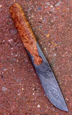 a knife that is laying on the ground