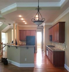 an empty kitchen and living room in a house