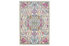 a rug with an ornate design on the front and back side, in multicolored colors