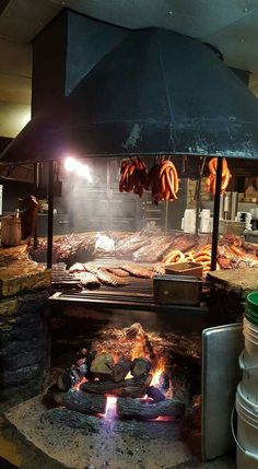 an outdoor grill with food cooking on it