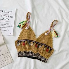 Name:V-neck small halter tank topMaterial:blendedColor:apricot,white,khaki,black ,greenFeatures:embroidered,ethnic style,bohemianSize(cm):free 1inch=2.54cmlength:38,bust:70-90,waist:54-64 Can be adjustedNote:Due to different measurement methods,there will be 1-3 error(unite:cm), please understand.&ltp&gtPlease check the size carefully when you choose items,thank you.</p>&ltbr/> Camisole Crop Top With Built-in Bra For Vacation, Vacation Crop Top With Built-in Bra And Spaghetti Straps, Sleeveless Crop Top With Built-in Bra For Beach, Beach Camisole Crop Top With Built-in Bra, Summer Vacation Halter Top With Built-in Bra, V-neck Crop Top For Beach, V-neck Halter Top With Built-in Bra For Vacation, Trendy V-neck Halter Top For Vacation, Spring Festival V-neck Halter Top