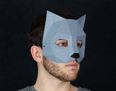 Make your own 3D cat masquerade with paper or cardboard at home in minutes thanks to our printable template for kids and adults. ⚡ If you purchase this product you will have instant access to the PDF file (with easy-to-follow instructions and pattern) so you can print, assemble and customize the papercraft mask to your liking." 📐 Mask dimensions: 14,6 cm x 17 cm x 12,8 cm / 5.7'' x 6.7'' x 5.0''. 📌 PDF content: 6 pages, 8 pieces. 🌲 For every mask you buy, we plant a tree!  ➤ https://hekreatio Cat Mask Diy, Papercraft Mask, Paper Mask Template, Low Poly Mask, Mascaras Halloween, Printable Masks, Lion Mask, Fox Mask, Diy Kostüm