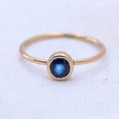 Blue Sapphire Gemstone Ring, 8 US/ 14k Yellow Gold Ring, Gold Jewelry Ring, Faceted Sapphire Gemstone Ring, Statement Ring, Easter Gifts GEMSTONE DETAILS : ✦ Gemstone : Sapphire ✦ Gemstone Shape : Round  ✦ Gemstone Color : Blue  ✦ Gemstone Cut : Faceted ✦ Number of Gemstones : 1 ✦ Gemstone Weight : 0.3 CT's  ✦ Number of Gemstones : 1 ✦ Gemstone Grade: Excellent METAL DETAILS : ✦ Metal : 9K Yellow Gold ✦ Ring Size : 5 US  ✦ Gross Weight : 0.9 Gram  ✦ Setting : Bezel Setting  ✦ Ring Box : Yes CUST 14k Gold Birthstone Ring With Smooth Bezel, 14k Gold Birthstone Ring With Smooth Bezel For Promise, Everyday Round 14k Gold Sapphire Ring, Round Sapphire Ring With Smooth Bezel For Promise, Everyday 14k Gold Round Sapphire Ring, Everyday 14k Gold Sapphire Ring, Round Cut, Everyday 14k Gold Sapphire Ring, Blue Stackable Jewelry For Everyday, Blue Stackable Everyday Jewelry