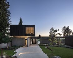 the house is surrounded by trees and grass