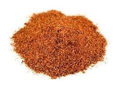 a pile of ground spices on a white background