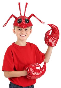 a young boy wearing a red lobster costume