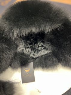 Description Stay warm and stylish with our Genuine Polar Fox Fur Genuine Leather Hat. Made with real Polar fox fur and genuine leather, this winter hat features ear flaps for added protection. Indulge in luxury and sophistication with this exclusive and elegant accessory. Product Details: Shell: genuine leather Fur: genuine Polar Fox Lined for comfort One size fits all Made in Turkey Web ID: A096 Care Instructions: Spot clean when necessary. Black Hat With Faux Fur Lining, Luxury Winter Hats With Faux Fur Lining, Luxury Winter Hat With Faux Fur Lining, Leather Hats, Elegant Accessories, Fox Fur, One Size Fits All, Stay Warm, Winter Hats