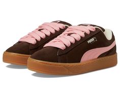 PUMA Suede Xl - Women's Lace up casual Shoes : Chestnut Brown/Peach Smoothie/Frosted Ivory : Give your classic footwear collection a trendy update with the PUMA Suede Xl Sneakers, crafted in a modern street inspired silhouette with contrasting lace-up closure and formstip pattern. The sneakers come with a leather upper, suede tongue with mesh binding, leather lining, and cushioned rubber insole. The PUMA branding on quarter panel and FOT Mesh lining Mesh sockliner with repeat screen printed PUMA branding add both style and authenticity. Leather working group sustainability. Round toe. Rubber outsole. Imported. Measurements: Weight: 1 lb 8 oz Product measurements were taken using size 6, width B - Medium. Please note that measurements may vary by size. Brown Sneakers With Contrast Sole For Spring, Spring Brown Sneakers With Contrast Sole, Brown Sneakers With Gum Sole For Spring, Brown Gum Sole Sneakers For Spring, Brown Suede Flat Sneakers, Brown Cushioned Sneakers For Spring, Brown Lace Sneakers For Spring, Pink Suede Sneakers With Textured Sole, Casual Peach Round Toe Sneakers