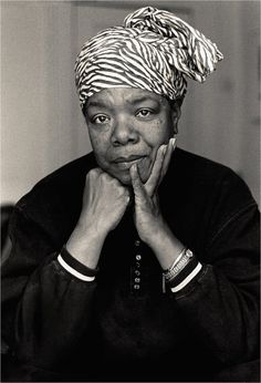 a black and white photo of a woman wearing a turban