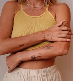 a woman with tattoos on her arms