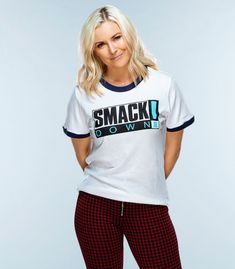 a woman posing for the camera wearing pajamas and a t - shirt that says smack down