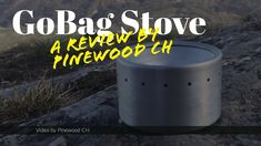 a metal container sitting on top of a rocky hill with the words gobag's stove above it