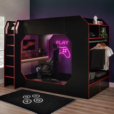 a room with a bed, desk and chair in it that has neon lights on the walls