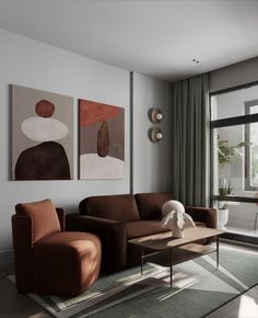 a living room with two paintings on the wall