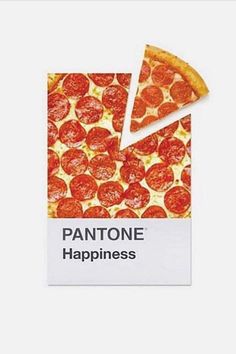 a piece of pizza sitting on top of a white sign that says pantone happiness