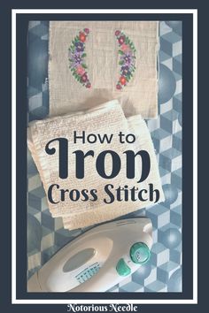 an iron and some towels on top of a table with the words how to iron cross stitch