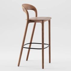 a wooden bar stool with a black metal ring around the seat and backrests