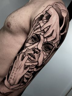 a man's arm with a tattoo on it that has an image of a demon