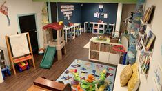 a child's playroom filled with toys and books