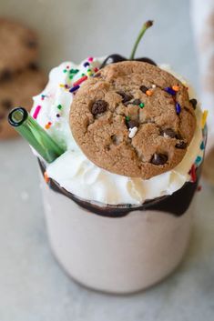 an ice cream sundae with chocolate chip cookies and sprinkles on top