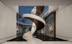 a spiral staircase in the middle of a room