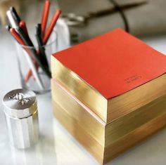 a red and gold box sitting on top of a table