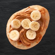 sliced bananas and peanut butter on top of a flatbread