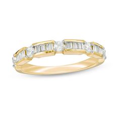 a yellow gold wedding band with baguettes