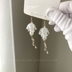 Jellyfish Dangle Earrings - Cute Jellyfish drop Earrings - Unique Earrings - Beach vibes Earrings 🤍 Hypoallergenic 🌸 Handmade with love ✨ Cute & Dainty  🎁 Gift ready 〰️Click👇🏻 Find more Earrings🎀  https://www.etsy.com/shop/byYeeSo ◽️ PACKAGING ◽️  * The jewelry will be nicely packaged * Comes with a drawstring suede pouch * If you need personalized gift note, please click the link below, add it to your cart when check out to upgrade your packaging. https://www.etsy.com/listing/1008661207/u White Crystal Dangle Earrings, Whimsical White Drop Earrings, White Long Drop Crystal Earrings Gift, White Long Drop Crystal Earrings, Whimsical White Dangle Jewelry, Clear Dangle Earrings For Pierced Ears, Cute Jellyfish, Earrings Beach, Pretty Packaging