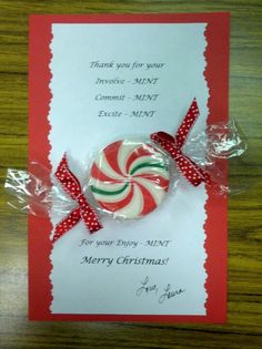 a candy bar is wrapped in red and white paper