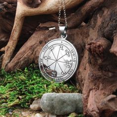 This stunning Sixth Pentacle of Saturn pendant necklace is made from pure .925 sterling silver and comes with a waxed black cord and your choice of solid sterling silver necklace chains! No coatings, no plating, just sterling silver! Discover our Sixth Pentacle of Saturn pendant, a stunning planetary talisman crafted from pure .925 sterling silver. This iconic sigil, also known as a King Solomon Seal, is a unique design from the book "The Greater Key of Solomon." Saturn is often associated with structure, order, and wisdom. The Sixth Pentacle of Saturn is thought to help individuals develop these qualities, overcoming obstacles and achieving their goals. This talisman is believed by some to ward off evil spirits, protect against harm, and provide strength and resilience. Originally feature Solomon Sigil, Sigil Necklace, Saturn Pendant, Solomon Seal, Key Of Solomon, King Solomon Seals, Saturn Necklace, Solomons Seal, King Solomon