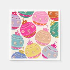 a card with colorful christmas ornaments on it