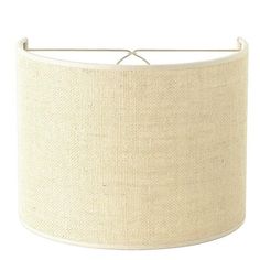 a white lamp shade with a metal rod on the bottom and an off - white background