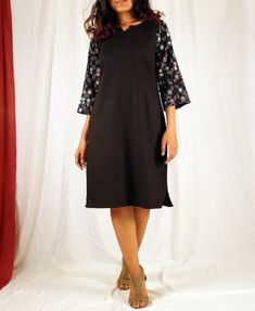 Black tunic dress for women, Linen shift dress, Hand block print dress, Linen tunic dress, Made to order, Custom made, Plus size-Model height: 5'3" wearing size S-Length: 38"-Mirror workHand block printing is a centuries old Indian art form that utilizes a hand carved teak wood block that is dipped in dye and stamped by hand onto cotton or silk. We have used simple floral motifs to create elegant designs for our comfortable shift dresses. Black Cotton Tunic Dress, Black Straight Kurta For Summer, Black Cotton Straight Kurta Dress, Black Dresses With Printed Motifs For Festive Season, Fitted Black Dress With Printed Motifs, Festive Black Dress With Printed Motifs, Cream Linen Dress, Block Print Dress, Black Tunic Dress