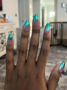 Metallic teal ombre nail art on a hand, showcasing a stylish nail design idea for your next appointment. Northern Lights Nails, Lights Nails, Galaxy Nail, Pop Art Nails, Sunset Nails, Floral Nail Designs