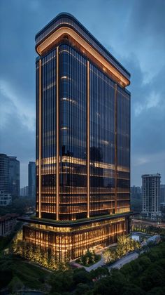 an office building lit up at night in the city