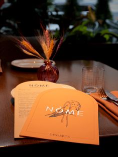 a table with place settings and napkins on it