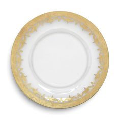 an empty white and gold plate on a white background