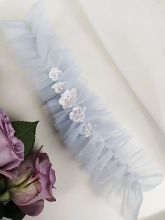 FREE SHIPPING TO USA FOR ALL ORDERS OVER 35$! We use FEDEX PRIORITY shipping service to the United States to guarantee the fastest delivery in 3-4 days. Beutiful modern tulle garter made of light blue tulle, finished with lace flowers. The base is rubber band so the garter does not slip on the leg and it is adjustable. Garters are presented in an gift organza bag. All garters are handmade in EU (Czech republic). Have questions? Feel free to send us a message! Blue Organza Tulle Fabric For Wedding, Blue Tulle Fabric For Wedding, Crystal Garter, Ivory Bridal Veil, Tulle Wedding Veil, Blue Garter, Wedding Bridal Veils, Wedding Garters, Lace Veils