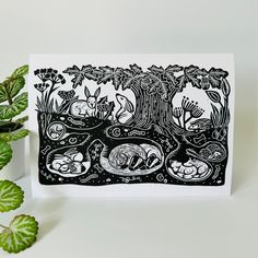 a card with an image of animals and trees