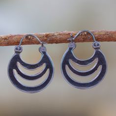 Evoking the shadows of crescents, elegant openwork details these hoop earrings from Mexico. Martha Vargas creates these earrings, which are crafted from sterling silver with a combination of finishes. Crescent Hoop Earrings With Ear Wire, Adjustable Crescent Sterling Silver Hoop Earrings, Sterling Silver Crescent Hoop Earrings, Metal Crescent Hoop Earrings, Crescent Oxidized Sterling Silver Earrings, Silver Crescent Hoop Earrings With Ear Wire, Adjustable Crescent Hoop Earrings, Nickel-free Crescent Jewelry, Crescent Shape