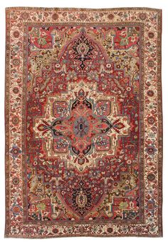 an antique persian rug with red and blue colors